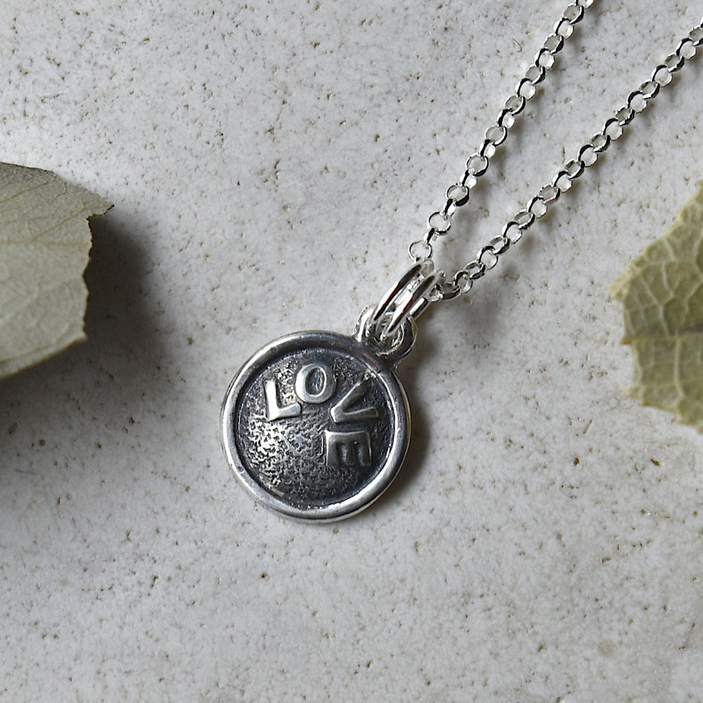 &#39;Love&#39; Tiny Die Struck Silver Necklace | Magpie Jewellery