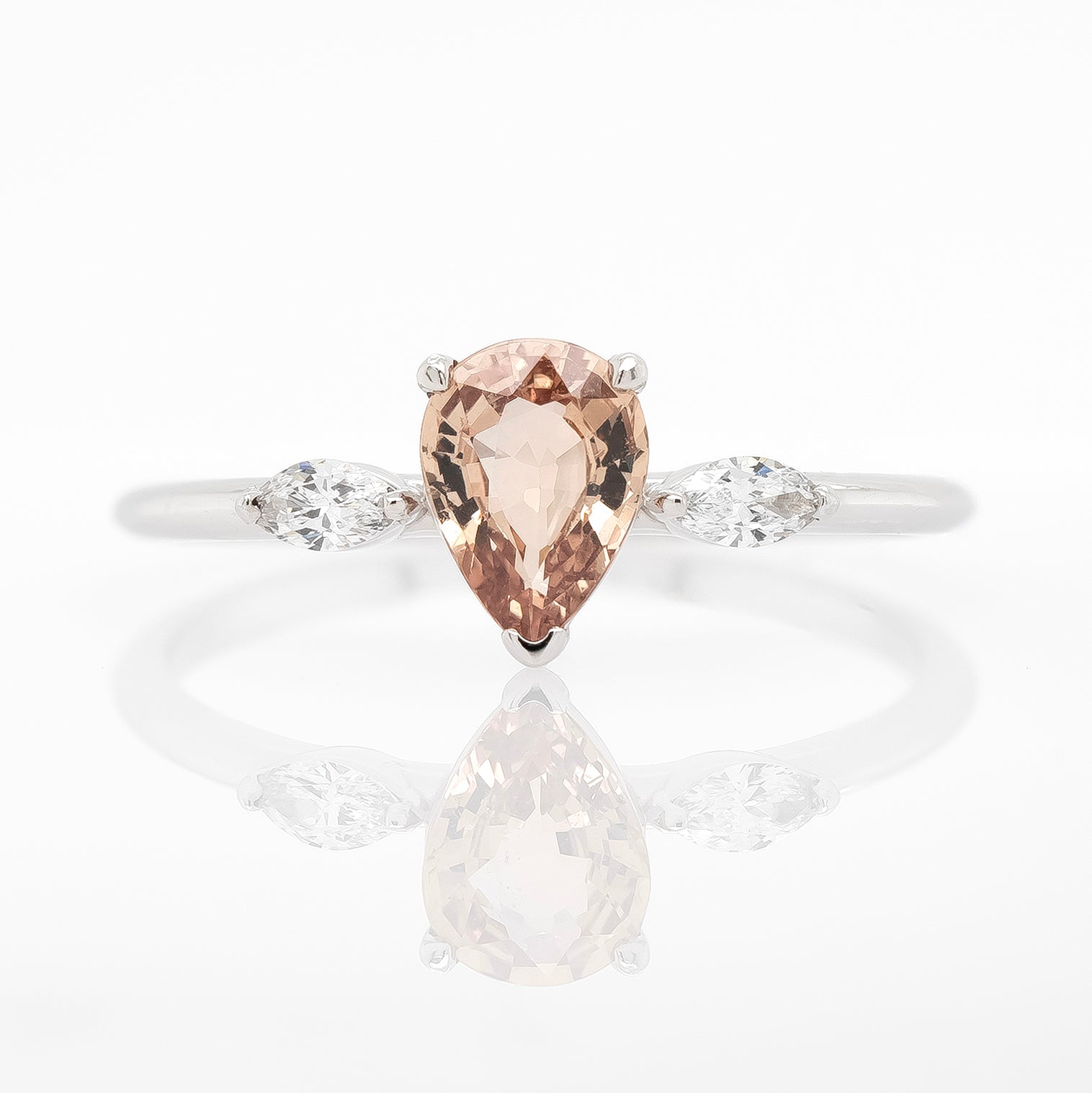Pear-Shaped Peach Sapphire Engagement Ring with Diamond Accents