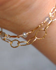 Hammered Oval Link Bracelet | Magpie Jewellery | Yellow Gold | On Model | Layered with Dapped Bar & Gemstone Chain Bracelet