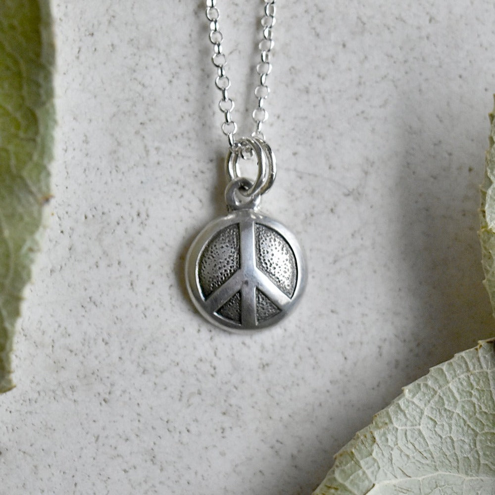 &#39;Peace&#39; Tiny Die Struck Silver Necklace - Magpie Jewellery