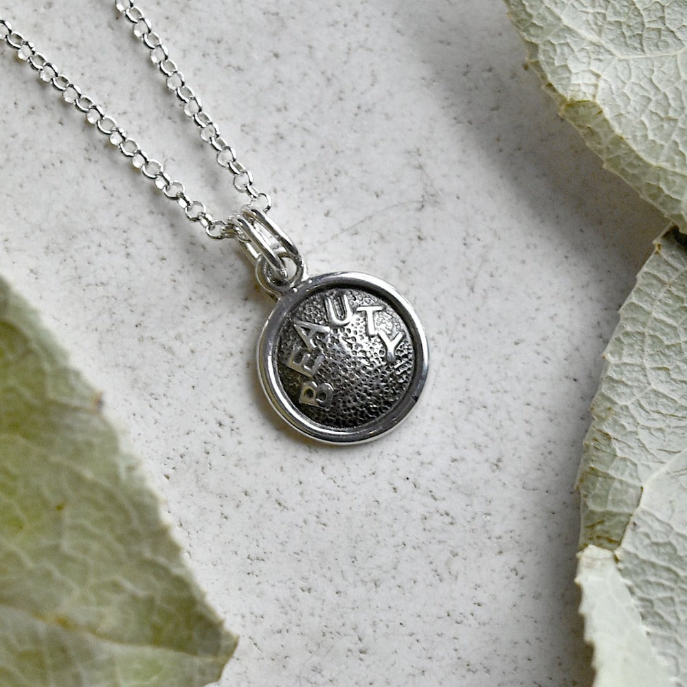 &#39;Beauty&#39; Tiny Die Struck Silver Necklace - Magpie Jewellery