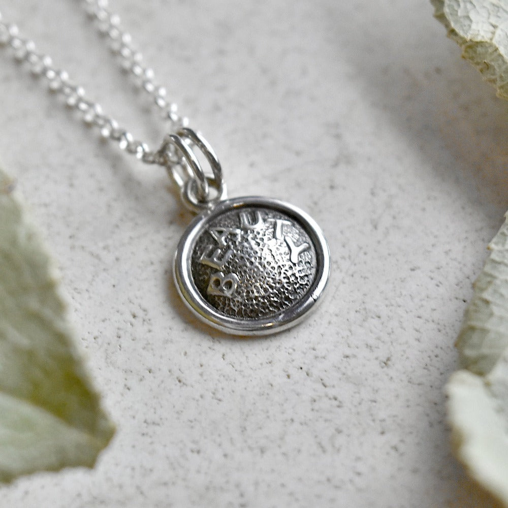 &#39;Beauty&#39; Tiny Die Struck Silver Necklace - Magpie Jewellery