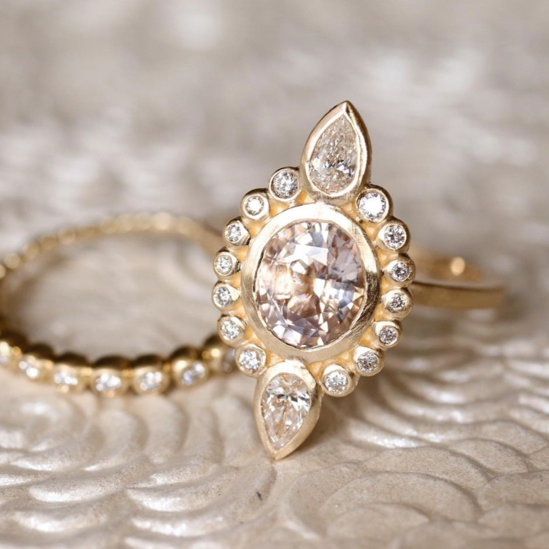 Pear shaped peach 2025 sapphire engagement rings