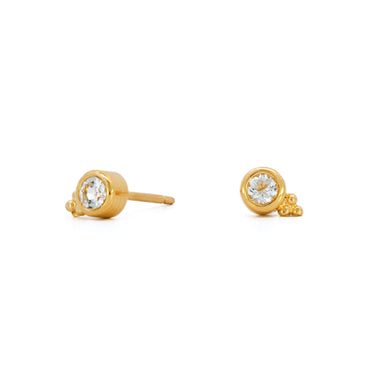 Small studs with bezel set white topaz gemstone.