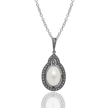 Oval Mabe Pearl Pendant with Prong Marcasite with an adjustable chain 16"-18" sterling silver oxidized.