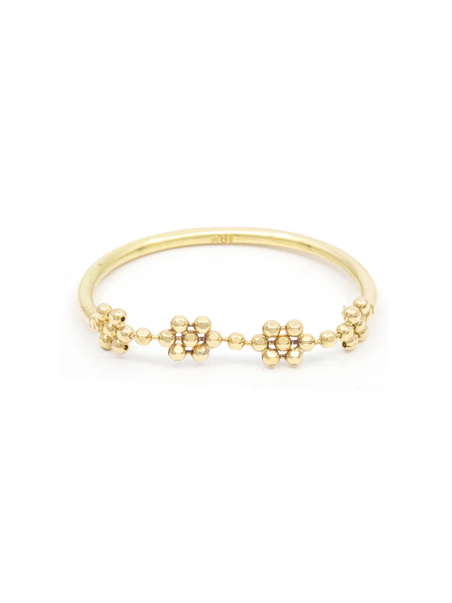 18k yellow gold ring featuring a beaded top shaped to be 4 mini flowers conected to a standard ring