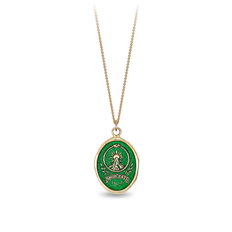 14k Yellow gold talisman Necklace with a bright Green background depicting a Sun rising over a tall mountain peak, with the words "amor fati" written below