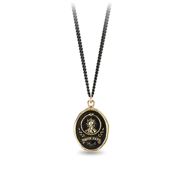 Black sterling silver necklace with a 14k Yellow gold talisman depicting a sun rising over a tall mountain peak with the words "amor fati" written below it
