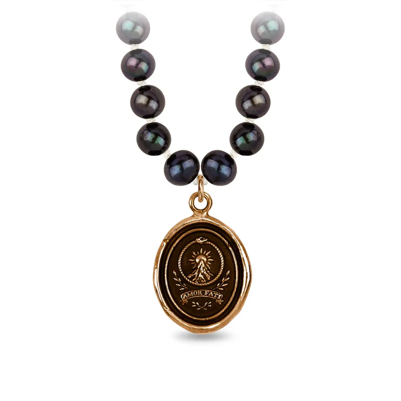 Peacock Black Freshwater Pearl Necklace with a Bronze talisman depicting a Large mountain with a sun behind the peak, and the text "amor Fati" below it