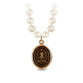 Ivory Freshwater Pearl Necklace with a Bronze talisman depicting a Large mountain with a sun behind the peak, and the text "amor Fati" below it