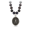 Peacock Black Freshwater Pearl Necklace with a Sterling Silver talisman depicting a Large mountain with a sun behind the peak, and the text "amor Fati" below it