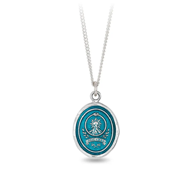 Sterling Silver talisman necklace with a Bright Blue Background depicting a sun rising over a big mountain with the words "amor fati" written at the base