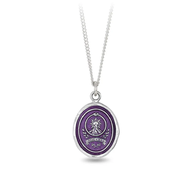 Sterling Silver talisman necklace with a Bright Violet Background depicting a sun rising over a big mountain with the words "amor fati" written at the base