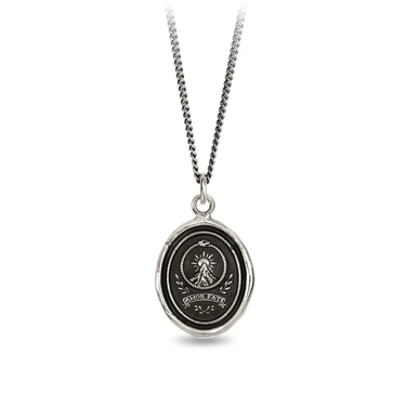 A Sterling Silver Pyrrha talisman With a Talisman depicting a tall mountain with a sun rising over it, including the text "Amor fati" written beneath it