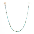 This Aqua necklace features Blue Peruvian Opal and Shiva Shell with a brass toggle clasp for convenient wear. 