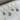 Sterling silver necklace featuring a ribbed circular pendant with a gemstone set at the center