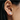 Small every day bean shaped stud earring made from sterling silver | on model