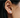 Small every day bean shaped stud earring made from sterling silver | on model