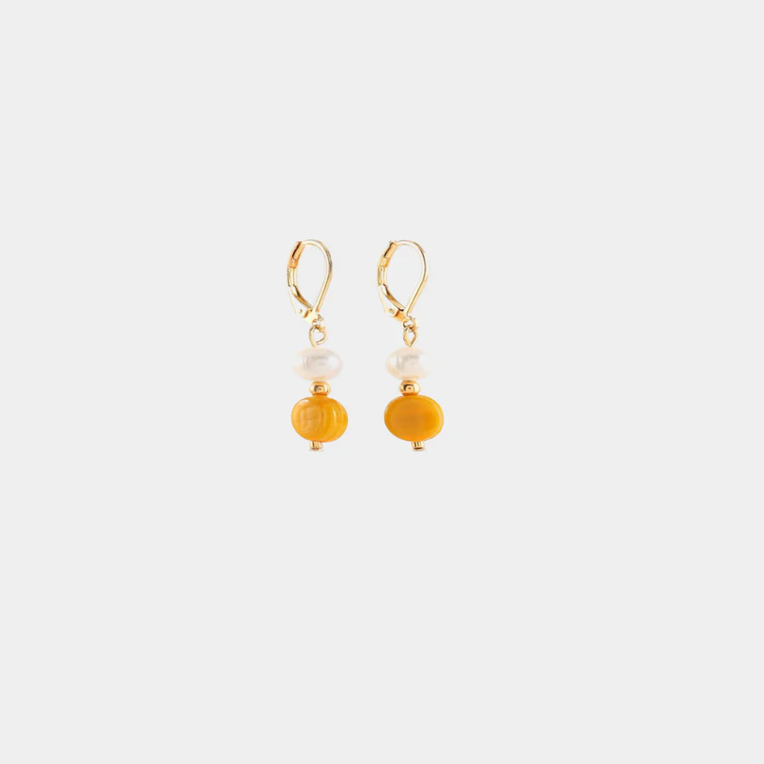 Delicate gold earrings with a freshwater pearl and a colorful orange bead