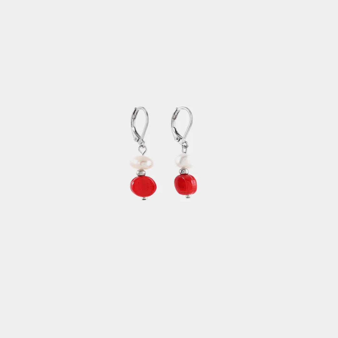 Delicate silver earrings with a freshwater pearl and a colorful red bead