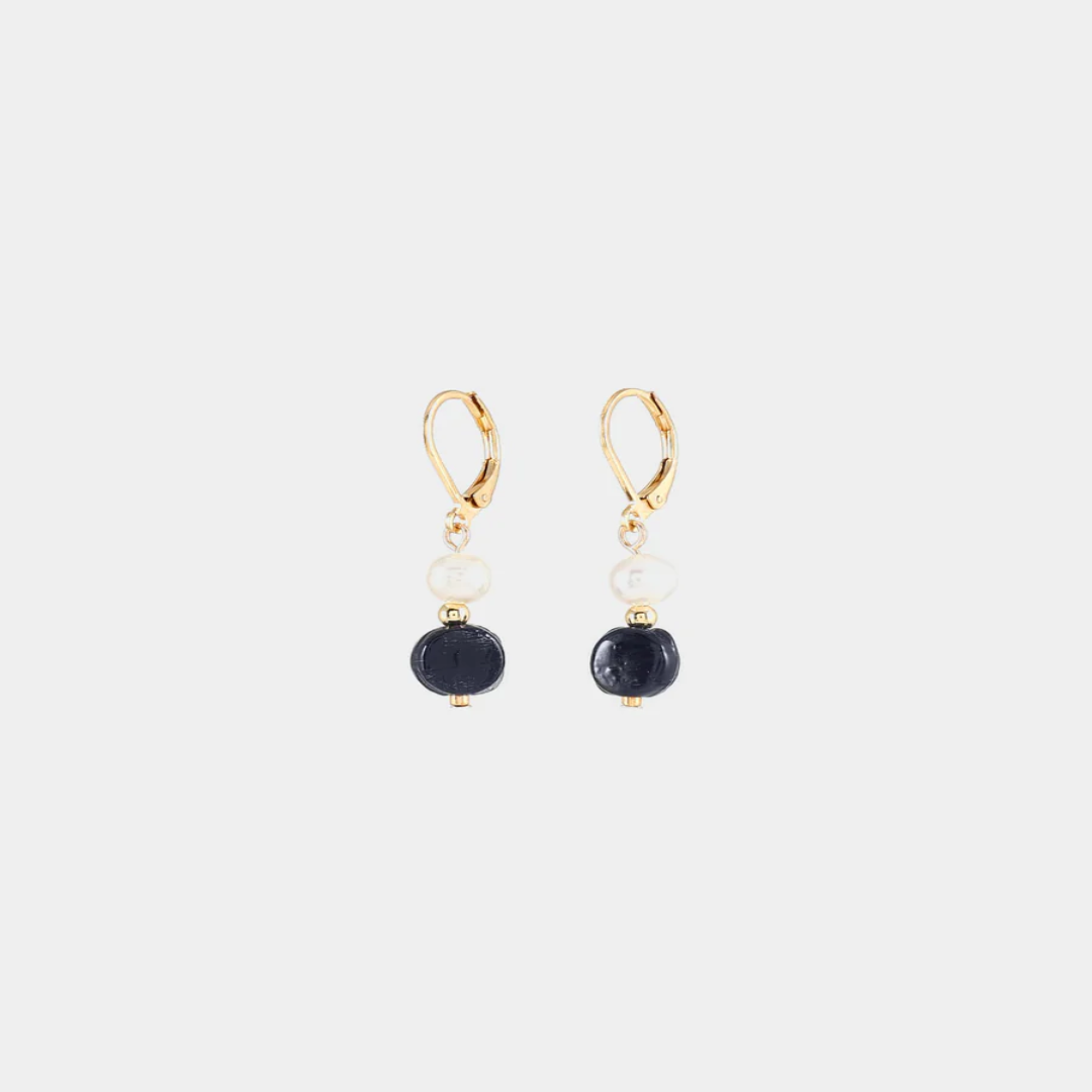 Delicate gold earrings with a freshwater pearl and a colorful black bead