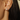 14k Yellow gold Plated sterling silver bezel studs, in an oval shape with a white topaz gemstone | on model