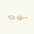14k Yellow gold Plated sterling silver bezel studs, in an oval shape with a white topaz gemstone