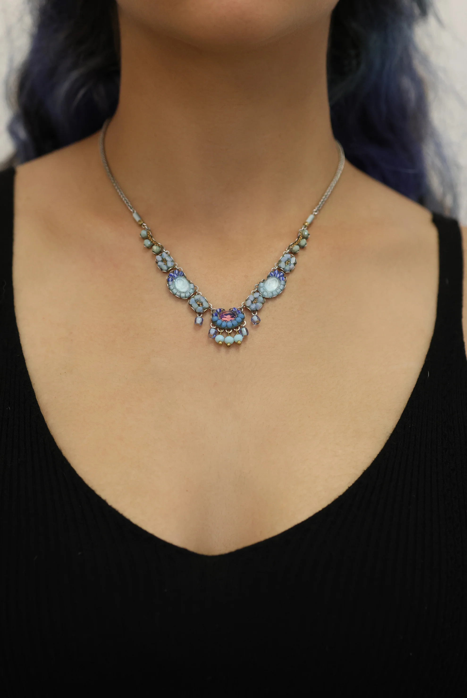 Plated Sterling Silver Bird Necklace predominantly featuring many strung together beads with the main colours being tones of blue and metal | on model