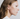 Small bunny shaped stud earring made from 14k gold plated Brass | on model