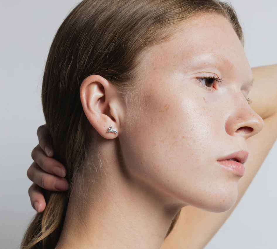 Small bunny shaped stud earring made from Sterling Silver | On model