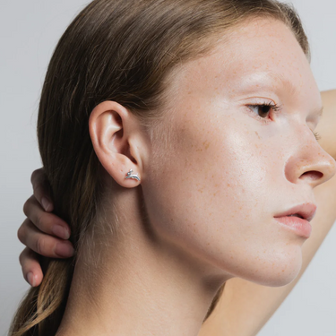 Small bunny shaped stud earring made from Sterling Silver | On model