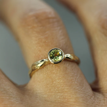 14k Yellow Gold Solitaire ring with a yellow sapphire studded at the top | On Model