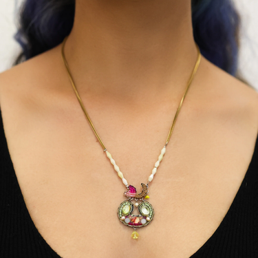 Plated Sterling Silver Necklace predominantly featuring many intricate beads shaped into an oval figure with a mosaic design with mainly green and red tones  | on model