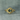 Celestial Teal Sapphire Ring in a rhombus shape with 6 studded balls around the .6ct green sapphire