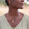 Gold Plated Silver Necklace with a Buttercup flower and Citrine Gemstone at the middle | On Model