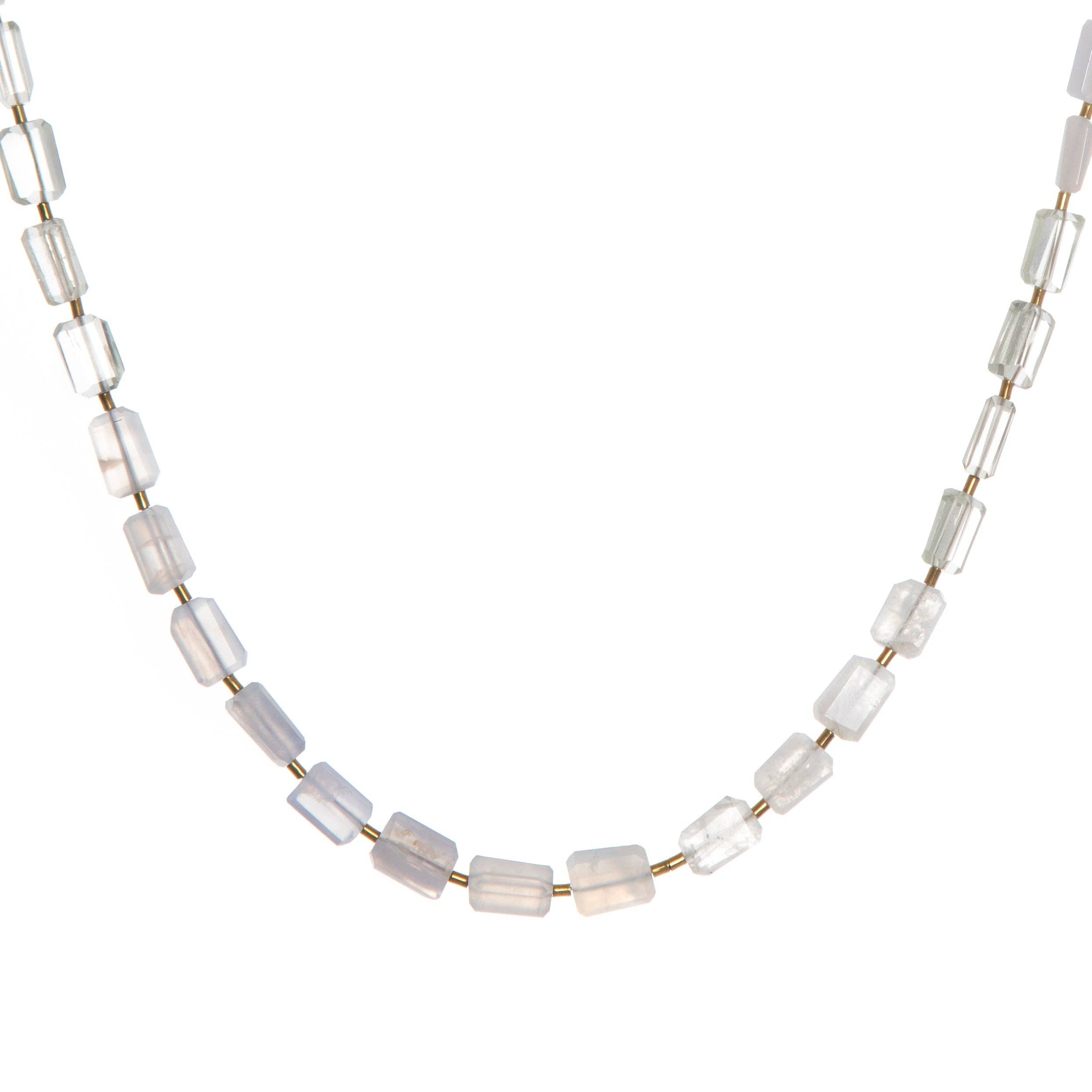 Cumulus necklace made in a graduated ombré style pattern, featuring hand-cut gemstones and Gold Hematite spacers