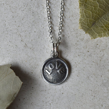 'Love' Tiny Die Struck Silver Necklace | Magpie Jewellery