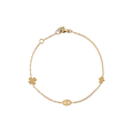 14k Yellow Gold Bracelet with a 4 leaf Clover, Dew Drop, and Eye Shaped Charms 