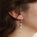 Short Two Toned earrings with colorful beads in varied shapes and a pewter nugget | on model
