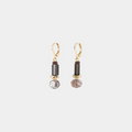 Short gold earrings with colorful black and white beads in varied shapes and a pewter nugget
