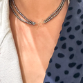 14k Yellow gold necklace featuring two strands of petite oval pearls, connected by a toggle clasp (black pearls depicted in picture) | on model