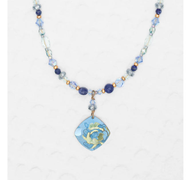 Niobium Beaded Necklace wiht blue and gold beads, featuring a floral pendant with blue flower and background accented with hints of green