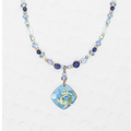 Niobium Beaded Necklace wiht blue and gold beads, featuring a floral pendant with blue flower and background accented with hints of green