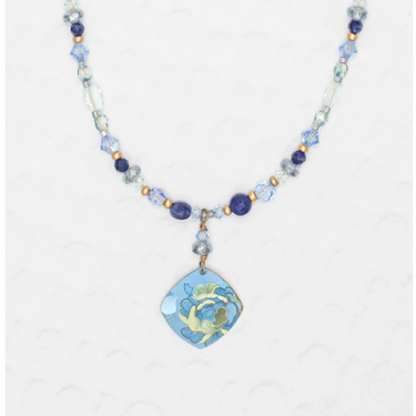 Niobium Beaded Necklace wiht blue and gold beads, featuring a floral pendant with blue flower and background accented with hints of green