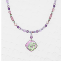 Niobium Beaded Necklace with purple and white beads featuring a purple pendant in the shape of a diamond with a green floral design