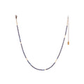 The Oso Necklace features hand-cut gemstones and recycled brass bars of varied lengths