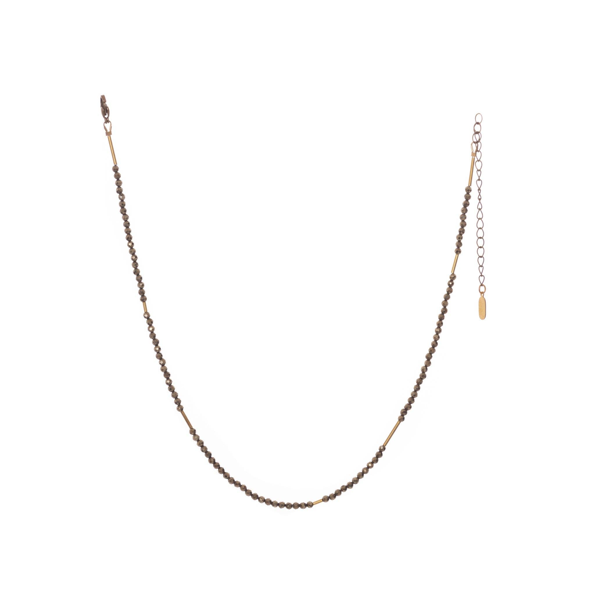 The Oso Necklace features hand-cut gemstones and recycled brass bars of varied lengths