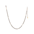 The Oso Necklace features hand-cut gemstones and recycled brass bars of varied lengths