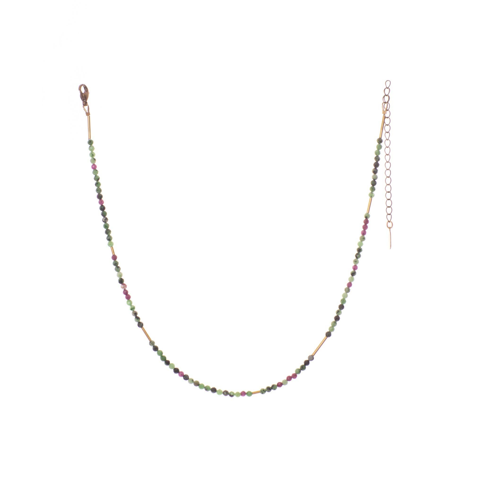 The Oso Necklace features hand-cut gemstones and recycled brass bars of varied lengths