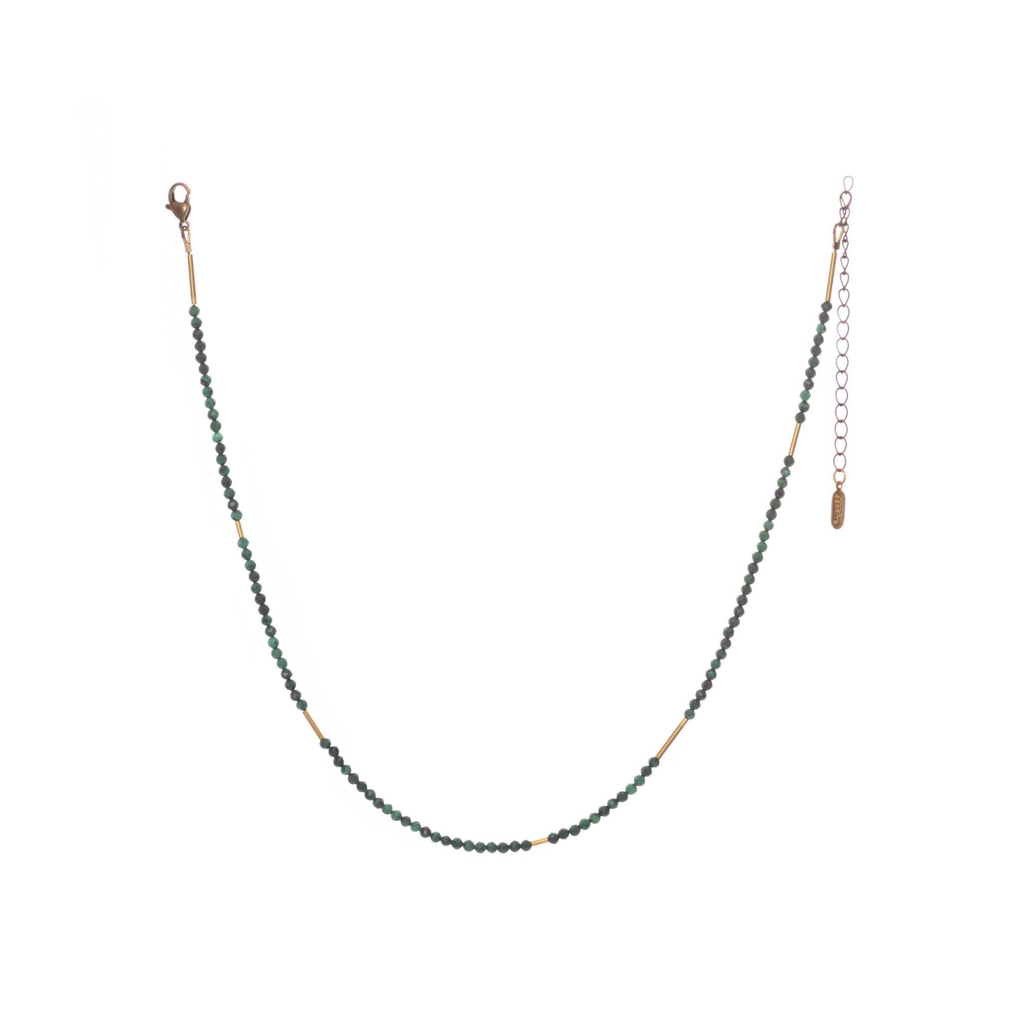 The Oso Necklace features hand-cut gemstones and recycled brass bars of varied lengths